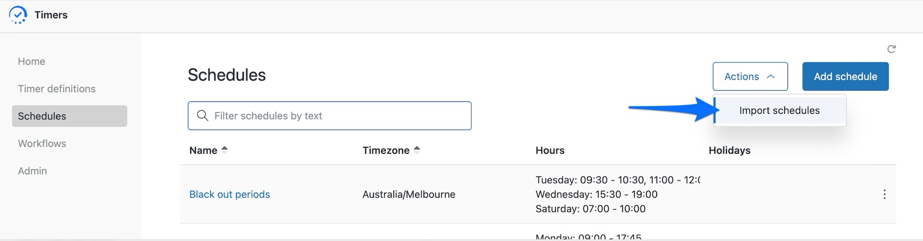 The Timers Schedules page with the Actions dropdown open at the top right, next to Add schedule, and an arrow pointing to Import schedules.